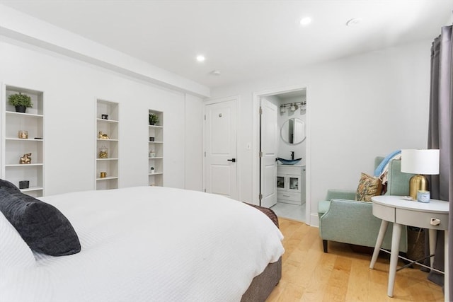 bedroom with light hardwood / wood-style flooring