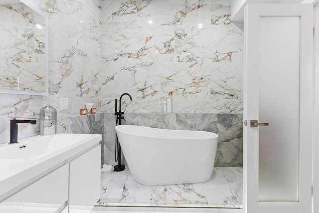 bathroom with vanity and a bathtub