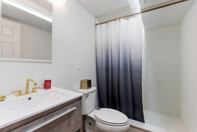 bathroom featuring vanity, toilet, and a shower with shower curtain