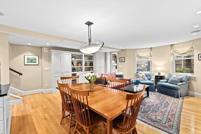 12 Braddock Park Unit 1, Boston, MA 02116 - dining area with light wood-style flooring, recessed lighting, baseboards, and stairs