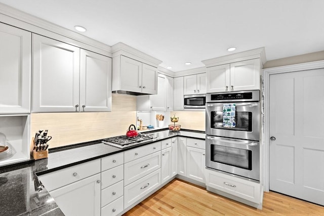 12 Braddock Park Unit 1, Boston, MA 02116 - kitchen with appliances with stainless steel finishes, white cabinets, decorative backsplash, and recessed lighting