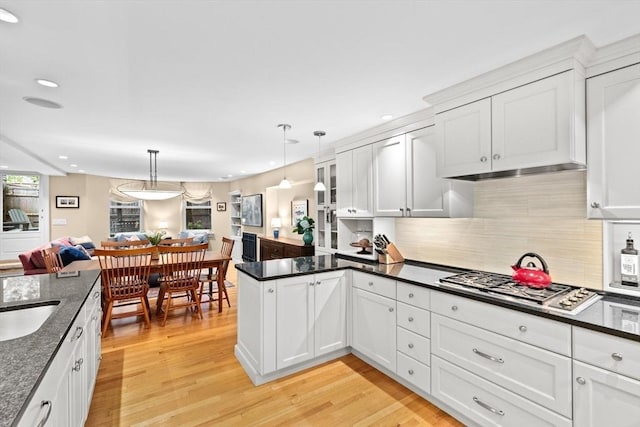 12 Braddock Park Unit 1, Boston, MA 02116 - kitchen featuring a peninsula, open floor plan, stainless steel gas cooktop, light wood finished floors, and recessed lighting
