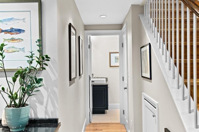 12 Braddock Park Unit 1, Boston, MA 02116 - hall featuring baseboards, stairs, a sink, light wood finished floors, and recessed lighting