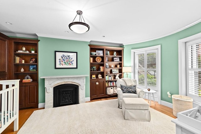 12 Braddock Park Unit 1, Boston, MA 02116 - sitting room with crown molding, a fireplace, wood finished floors, and baseboards