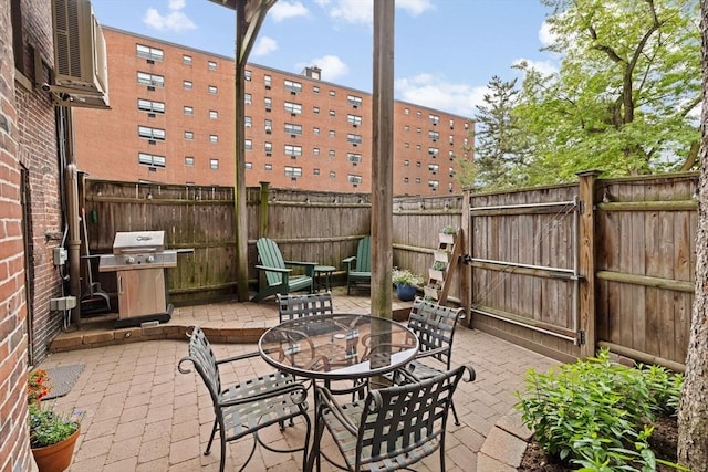 12 Braddock Park Unit 1, Boston, MA 02116 - fenced backyard with grilling area, a patio area, and a gate