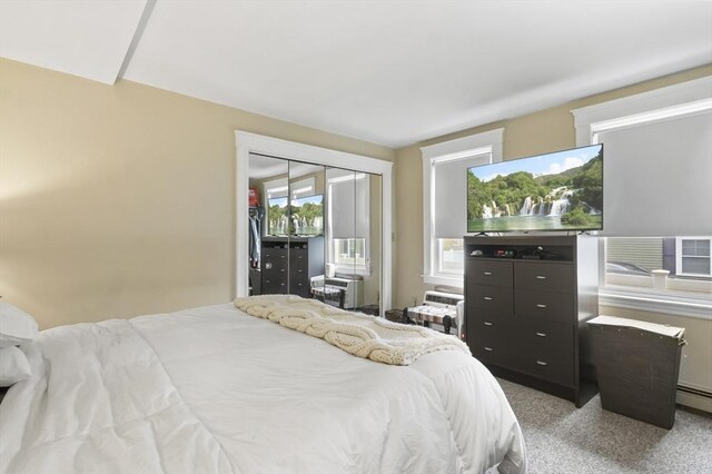 bedroom with a closet and light carpet