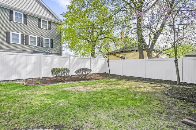view of yard with a fenced backyard