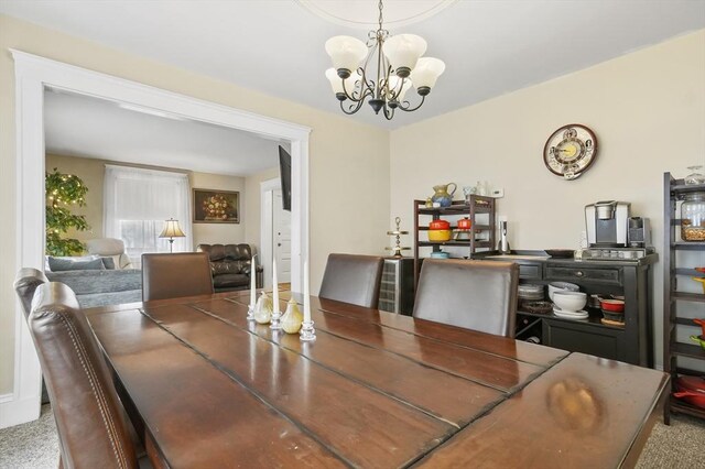 dining space featuring a chandelier