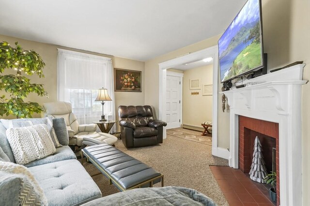 carpeted living area featuring baseboards, a fireplace with flush hearth, and a baseboard radiator