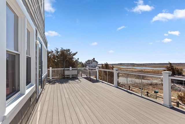 wooden deck featuring a water view