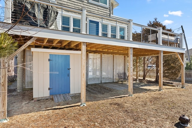 view of outbuilding with fence