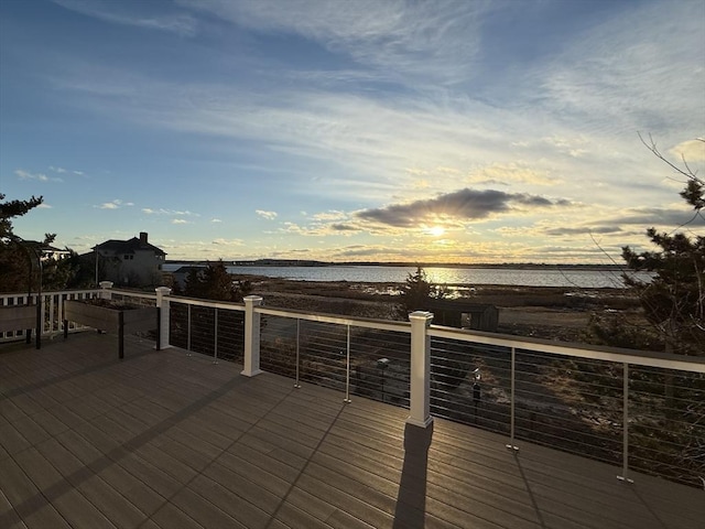 wooden deck featuring a water view