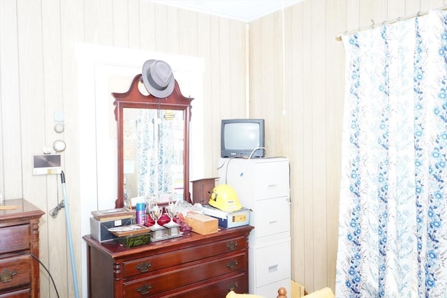 bedroom with wood walls