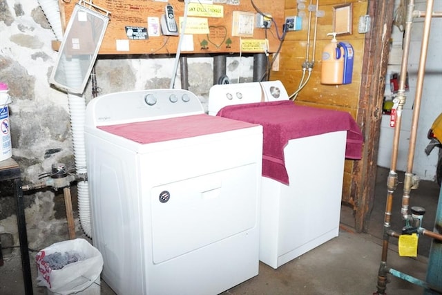 clothes washing area with independent washer and dryer