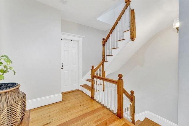 59 Bonair St, Somerville, MA 02145 - stairway with baseboards and wood finished floors