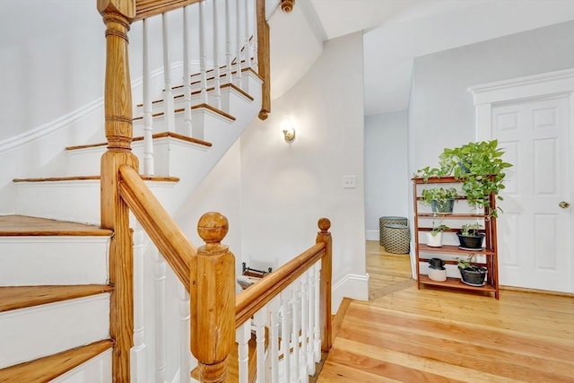 59 Bonair St, Somerville, MA 02145 - stairs featuring wood finished floors and baseboards