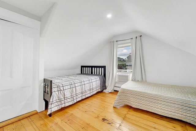 59 Bonair St, Somerville, MA 02145 - bedroom with hardwood / wood-style floors, lofted ceiling, and a baseboard heating unit