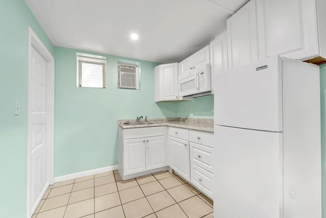 59 Bonair St, Somerville, MA 02145 - kitchen with white appliances, light countertops, white cabinetry, baseboards, and a sink