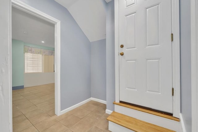 59 Bonair St, Somerville, MA 02145 - foyer entrance with tile patterned floors, lofted ceiling, and baseboards
