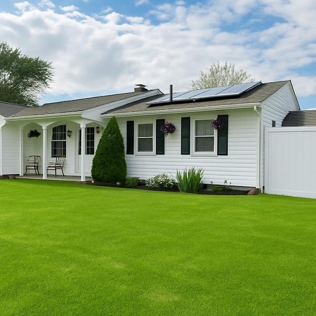 87 Nicholson Dr, Brockton, MA 02302 - ranch-style home featuring covered porch, a front yard, and roof mounted solar panels