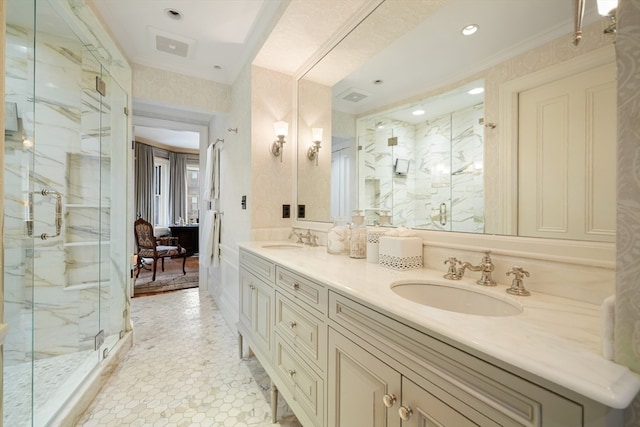 bathroom with ornamental molding, a shower with door, and vanity