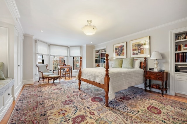 bedroom with ornamental molding and wood-type flooring