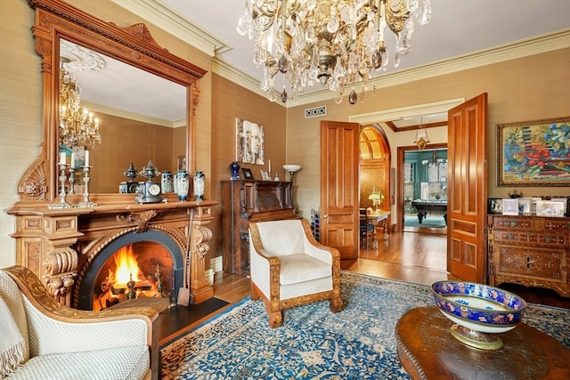 sitting room featuring ornamental molding and hardwood / wood-style floors