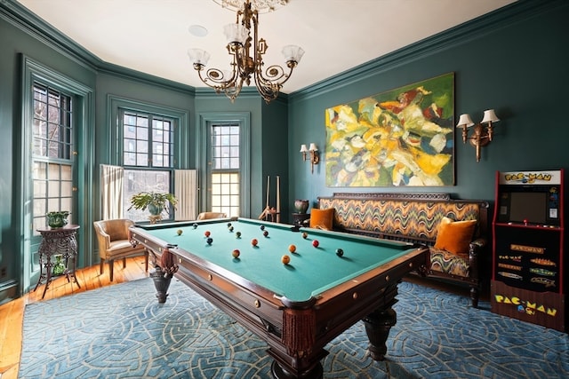 game room with dark hardwood / wood-style floors, crown molding, billiards, and a chandelier