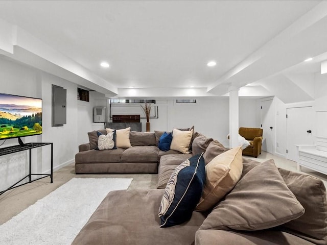 living room with electric panel, baseboards, and recessed lighting