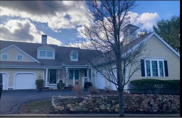 1 Hayloft Ln Unit 1, Marshfield, MA 02050 - view of front of home featuring a chimney, an attached garage, and driveway