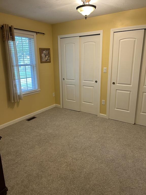 1 Hayloft Ln Unit 1, Marshfield, MA 02050 - unfurnished bedroom with light colored carpet and a closet