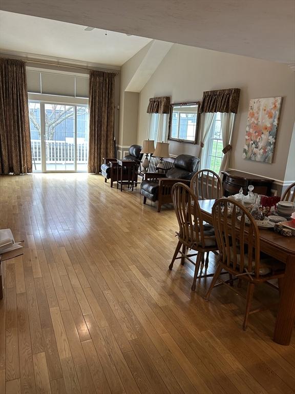 1 Hayloft Ln Unit 1, Marshfield, MA 02050 - dining area with hardwood / wood-style flooring and lofted ceiling