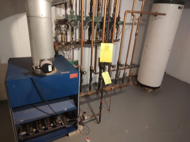 utilities featuring water heater and a heating unit