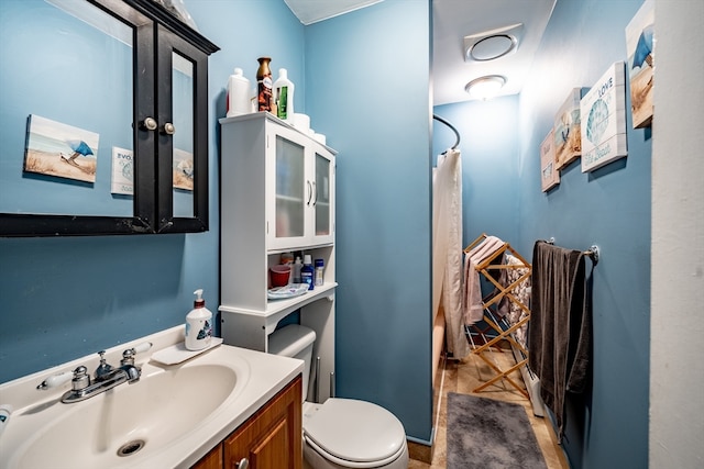 bathroom with vanity and toilet