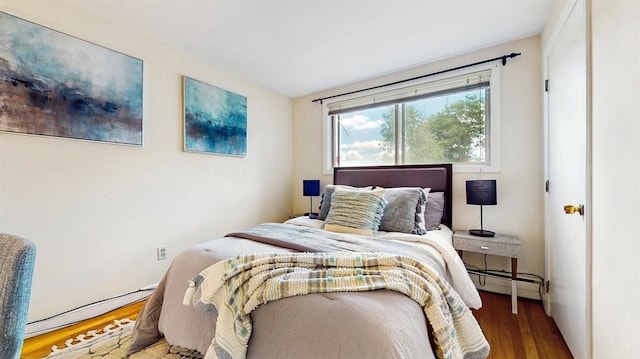 41 Lee Rd, Needham, MA 02494 - bedroom with wood finished floors and a baseboard radiator