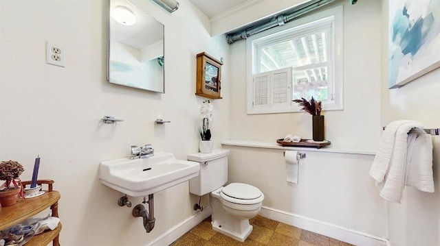 41 Lee Rd, Needham, MA 02494 - bathroom featuring baseboards, toilet, tile patterned floors, and a sink