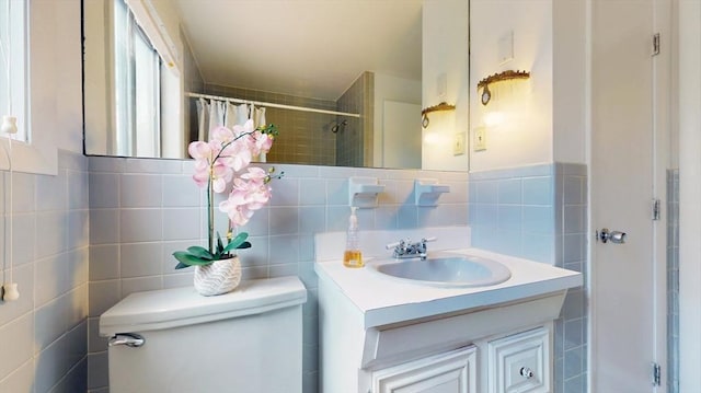 41 Lee Rd, Needham, MA 02494 - bathroom featuring tile walls, toilet, a tile shower, and vanity