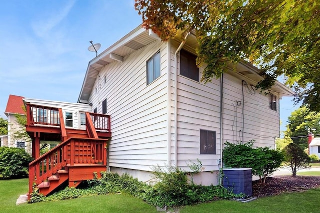 41 Lee Rd, Needham, MA 02494 - rear view of property with central AC, a lawn, stairs, and a wooden deck