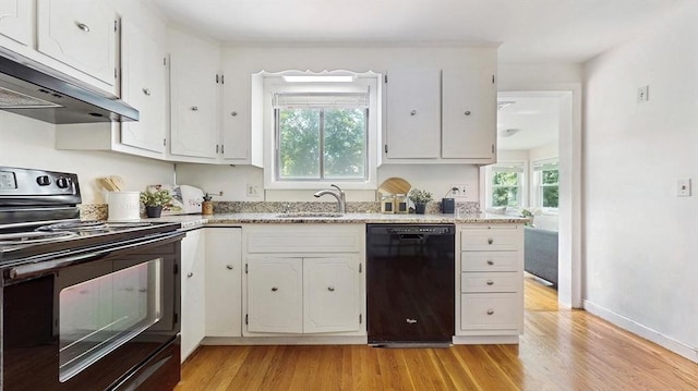 41 Lee Rd, Needham, MA 02494 - kitchen featuring black appliances, a sink, light wood-type flooring, and exhaust hood