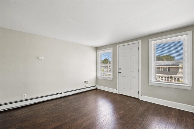 27 Whittier St, Fall River, MA 02724 - entrance foyer featuring a baseboard radiator and dark wood finished floors