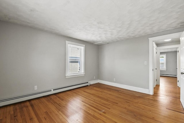 27 Whittier St, Fall River, MA 02724 - unfurnished room with a baseboard radiator and wood finished floors