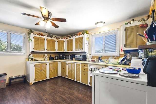 27 Whittier St, Fall River, MA 02724 - kitchen with electric range, light countertops, ceiling fan, dark wood-type flooring, and backsplash