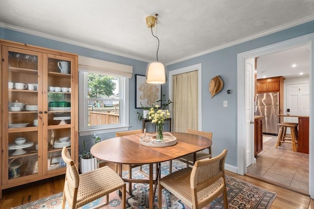 11 Netta Rd, Dedham, MA 02026 - dining area featuring light wood-style floors, baseboards, and crown molding