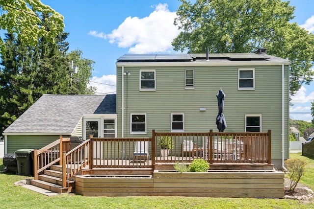 11 Netta Rd, Dedham, MA 02026 - back of property featuring solar panels, a lawn, and a deck