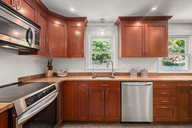 11 Netta Rd, Dedham, MA 02026 - kitchen with stainless steel appliances, a sink, healthy amount of natural light, light countertops, and recessed lighting