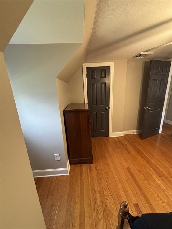 259 Gillette Ave, Springfield, MA 01118 - additional living space featuring baseboards, wood finished floors, and a textured ceiling