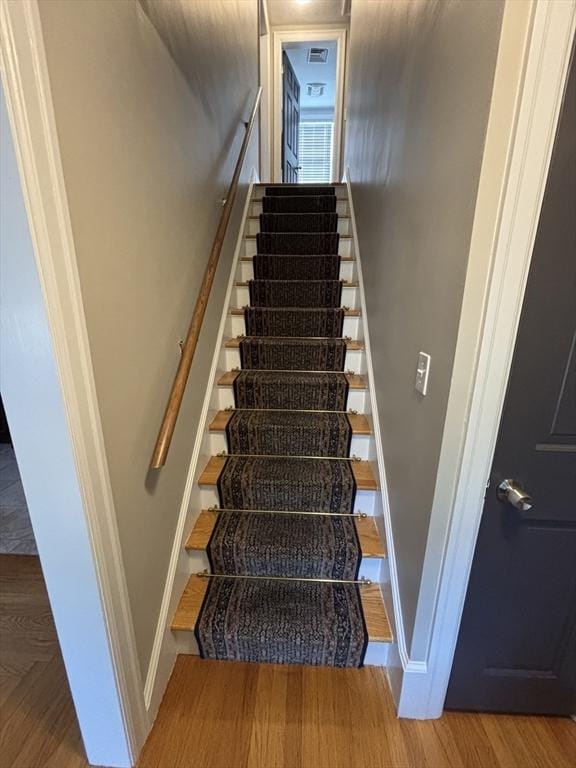 259 Gillette Ave, Springfield, MA 01118 - stairs featuring baseboards and wood finished floors