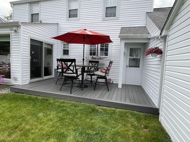 259 Gillette Ave, Springfield, MA 01118 - wooden deck featuring a lawn and outdoor dining space
