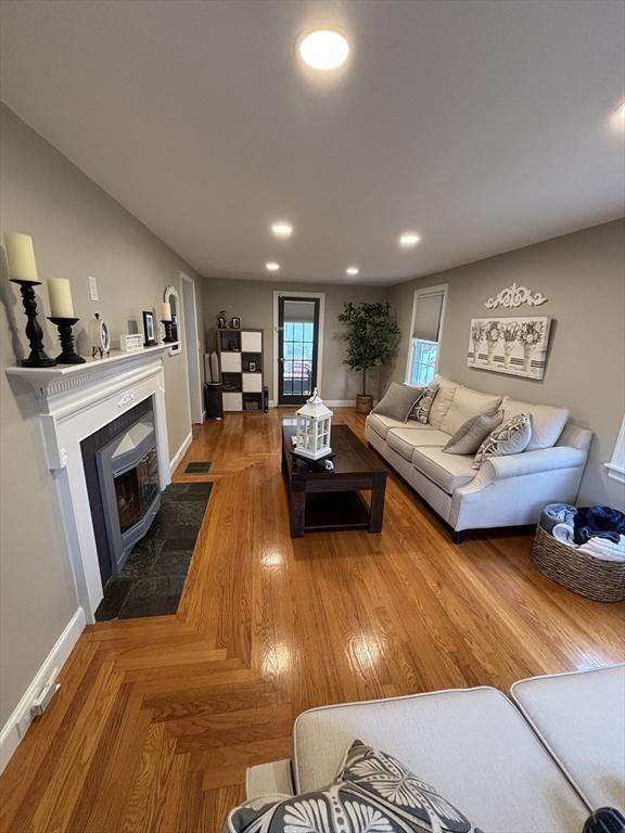 259 Gillette Ave, Springfield, MA 01118 - living area featuring a fireplace with flush hearth, baseboards, and recessed lighting
