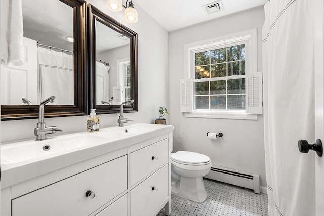 full bathroom featuring visible vents, double vanity, toilet, a baseboard heating unit, and a sink